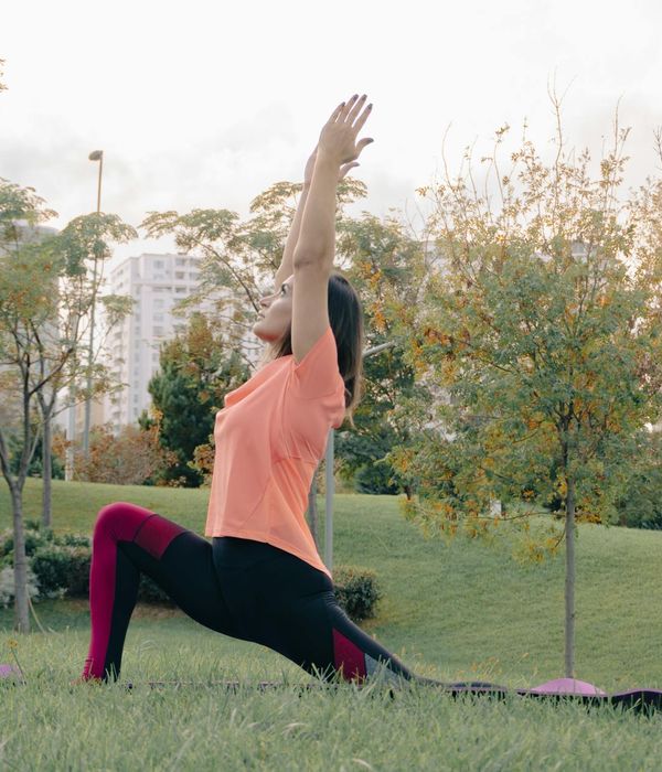 Woman in a calm yoga pose, embodying harmony and balance.